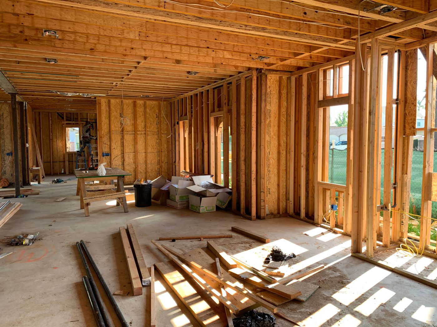 Framed home interior being assessed for where it loses energy